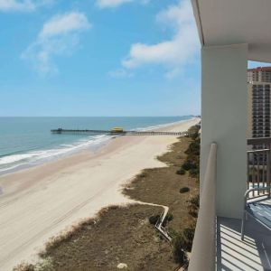Balcony from day use room overlooking the ocean at Embassy Suites By Hilton Myrtle Beach Oceanfront Resort.