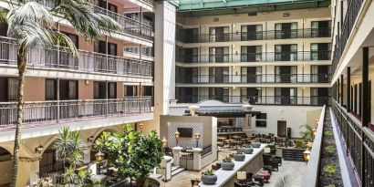 Lobby and coworking lounge at Embassy Suites By Hilton Los Angeles International Airport South.