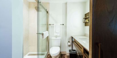 Guest bathroom with shower at Hilton Garden Inn Denver Union Station.