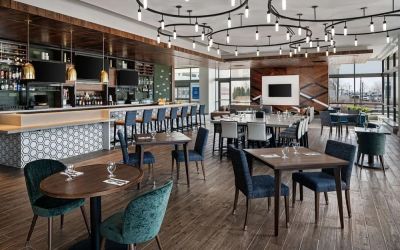 Dining area with natural light perfect for coworking at Hilton Garden Inn Camden Waterfront Philadelphia.