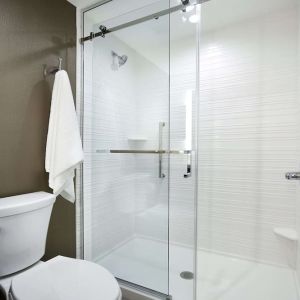 Guest bathroom with shower at Hilton Garden Inn Camden Waterfront Philadelphia.