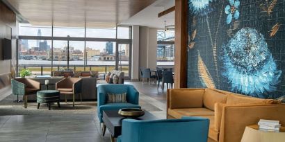 Lobby and coworking lounge at Hilton Garden Inn Camden Waterfront Philadelphia.
