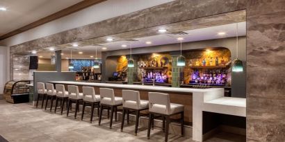 Hotel bar at DoubleTree By Hilton Tulsa - Warren Place.