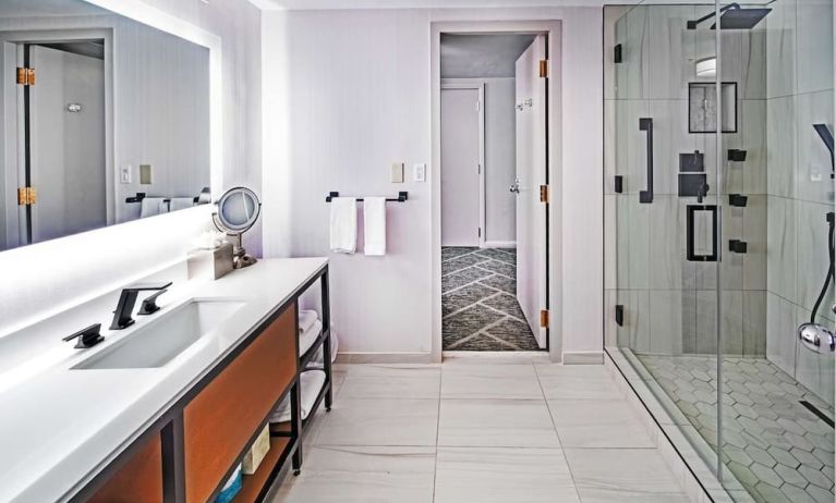 Guest bathroom with shower at DoubleTree By Hilton Tulsa - Warren Place.