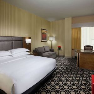 Day use room with work desk and sofa at Hilton Chicago-Northbrook.