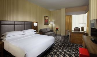 Day use room with work desk and sofa at Hilton Chicago-Northbrook.