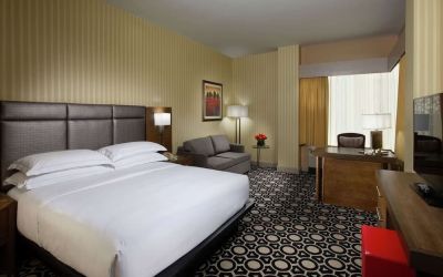 Day use room with work desk and sofa at Hilton Chicago-Northbrook.