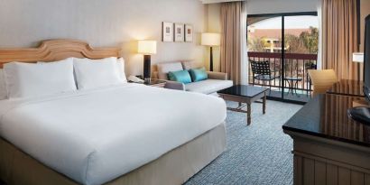 Day use room with work desk, sofa and balcony at DoubleTree By Hilton Sonoma Wine Country.
