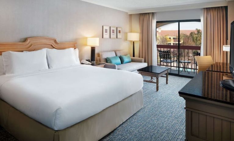 Day use room with work desk, sofa and balcony at DoubleTree By Hilton Sonoma Wine Country.
