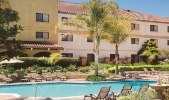 Refreshing outdoor pool surrounded by sun loungers at DoubleTree By Hilton Sonoma Wine Country.