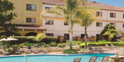 Refreshing outdoor pool surrounded by sun loungers at DoubleTree By Hilton Sonoma Wine Country.