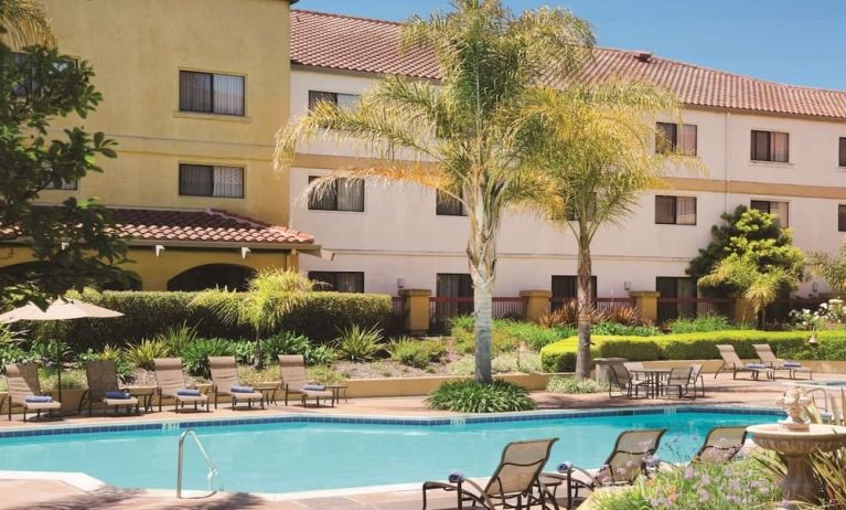 Refreshing outdoor pool surrounded by sun loungers at DoubleTree By Hilton Sonoma Wine Country.