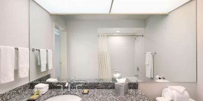 Guest bathroom with shower at DoubleTree By Hilton Sonoma Wine Country.