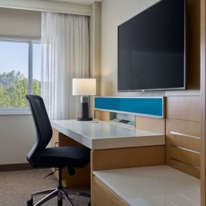 Work desk and TV at Delta Hotels By Marriott Little Rock West.