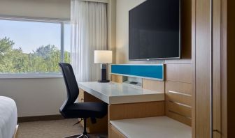 Work desk and TV at Delta Hotels By Marriott Little Rock West.