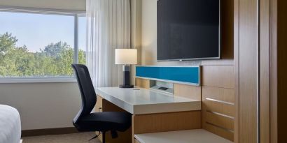 Work desk and TV at Delta Hotels By Marriott Little Rock West.