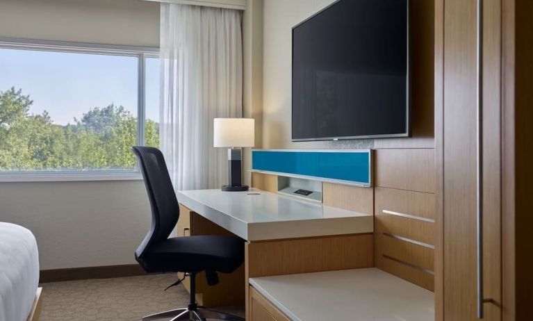 Work desk and TV at Delta Hotels By Marriott Little Rock West.
