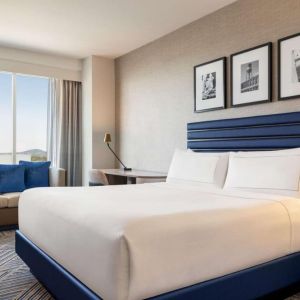 King bed at Hilton BNA Nashville Airport Terminal.
