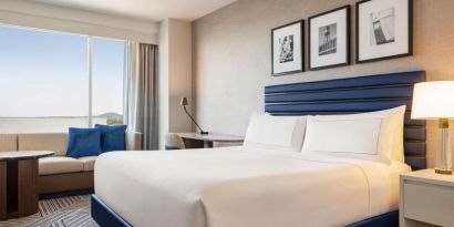 King bed at Hilton BNA Nashville Airport Terminal.
