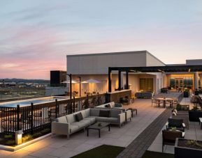Hotel rooftop with lounge area and pool at Hilton BNA Nashville Airport Terminal.
