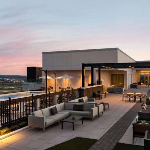 Hotel rooftop with lounge area and pool at Hilton BNA Nashville Airport Terminal.
