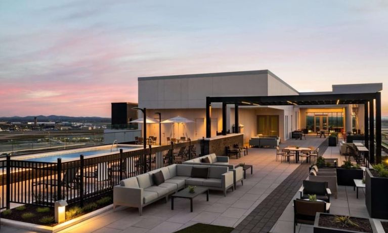 Hotel rooftop with lounge area and pool at Hilton BNA Nashville Airport Terminal.
