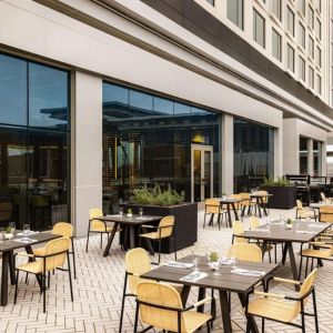 Hotel terrace with seating at Hilton BNA Nashville Airport Terminal.

