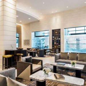 Hotel lobby with comfortable seating at Hilton BNA Nashville Airport Terminal.
