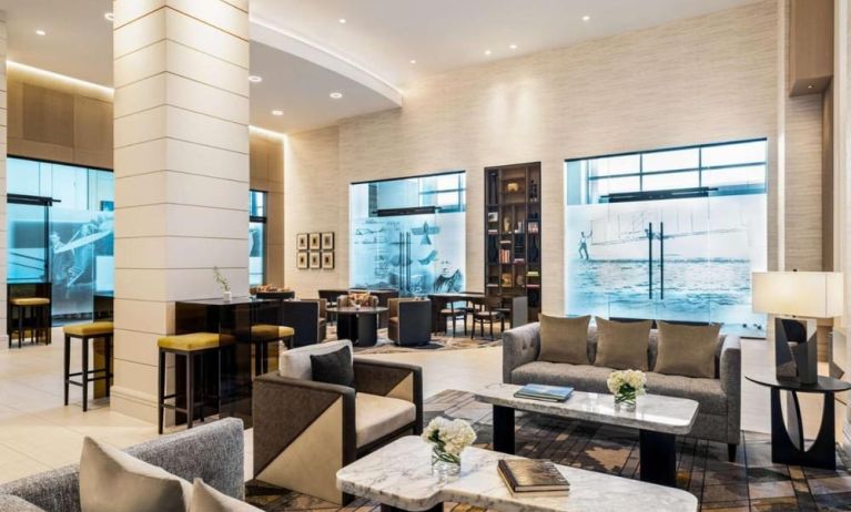 Hotel lobby with comfortable seating at Hilton BNA Nashville Airport Terminal.

