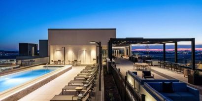 Beautiful rooftop with swimming pool and lounge area at Hilton BNA Nashville Airport Terminal.
