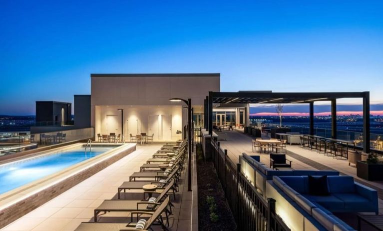 Beautiful rooftop with swimming pool and lounge area at Hilton BNA Nashville Airport Terminal.
