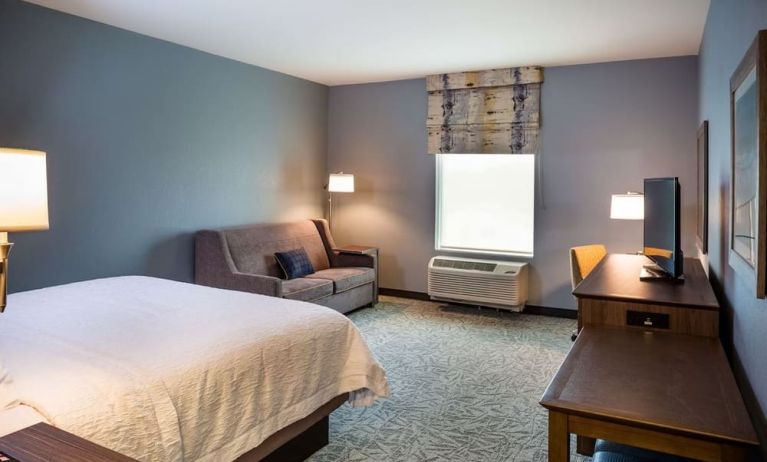 Day use room with work desk and sofa at Hampton Inn Atlantic City Absecon, NJ.
