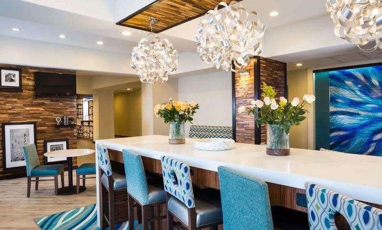 Lobby and coworking lounge at Hampton Inn Atlantic City Absecon, NJ.