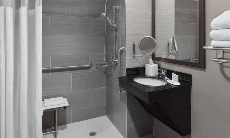 Ptivate guest bathroom with shower at Fairfield Inn & Suites By Marriott New York Staten Island.