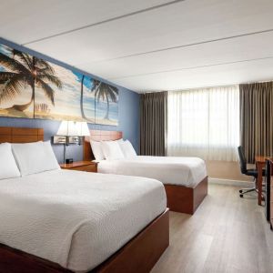 Day use twin room with work desk at EnVision Hotel Miami International Airport.