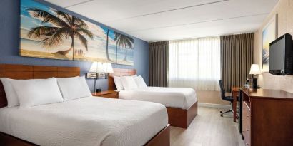 Day use twin room with work desk at EnVision Hotel Miami International Airport.