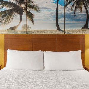 King bed at EnVision Hotel Miami International Airport.