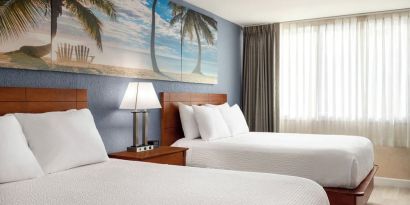Bright and spacious day use twin room at EnVision Hotel Miami International Airport.