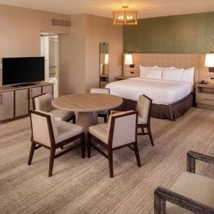 King suite with dining table at Hilton Birmingham At UAB.