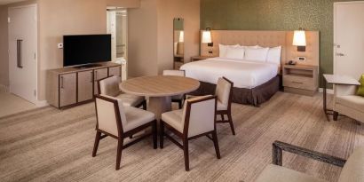 King suite with dining table at Hilton Birmingham At UAB.