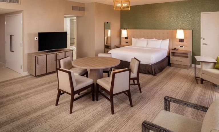 King suite with dining table at Hilton Birmingham At UAB.