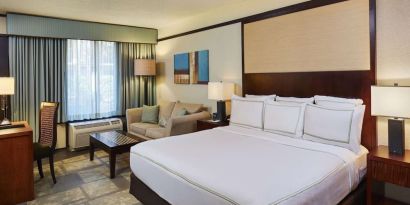 Day use room with sofa and work desk at DoubleTree By Hilton Orlando At SeaWorld.