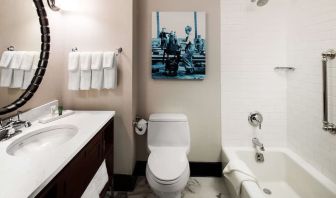 Private guest bathroom with tub at Hilton Brooklyn New York.