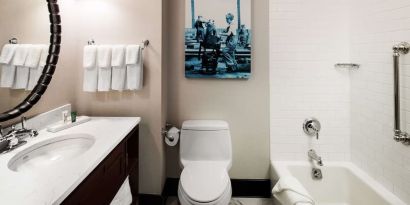 Private guest bathroom with tub at Hilton Brooklyn New York.