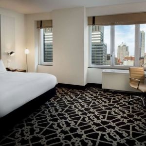 Bright and spacious day use room with work desk and city view at Hilton Brooklyn New York.