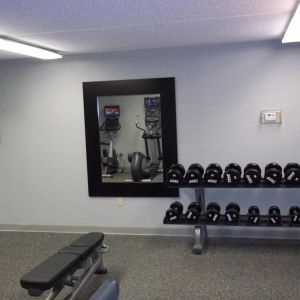 Fitness center at EnVision Hotel And Conference Center Mansfield Foxboro.