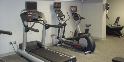Well equipped fitness center at EnVision Hotel And Conference Center Mansfield Foxboro.