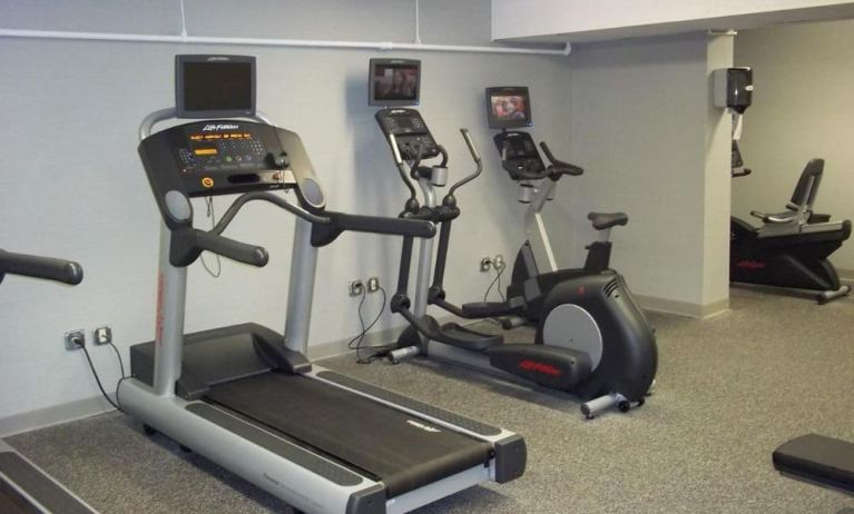 Well equipped fitness center at EnVision Hotel And Conference Center Mansfield Foxboro.