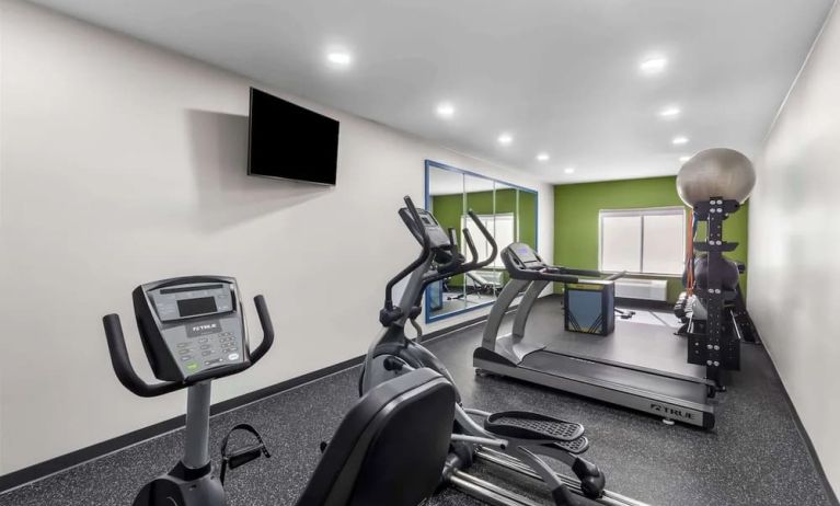 Well equipped fitness center at Spark By Hilton Pearland.