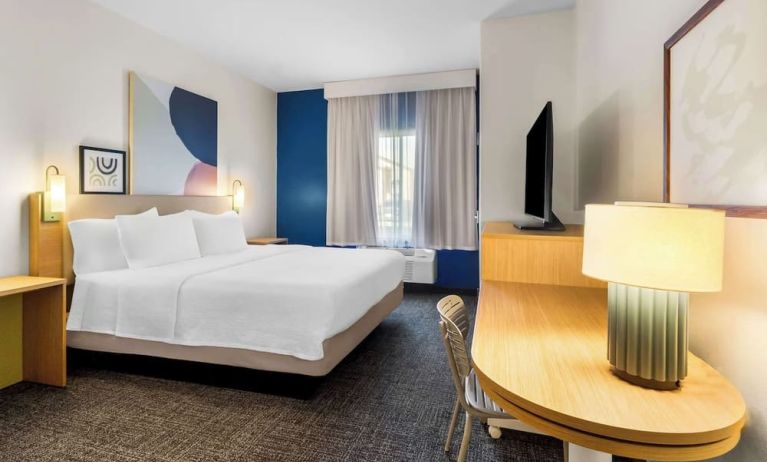 Day use room with natural light and work desk at Spark By Hilton Pearland.